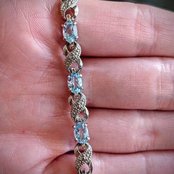 Blue Topaz and Diamond Accent Infinity Bracelet - Picture 9 of 9